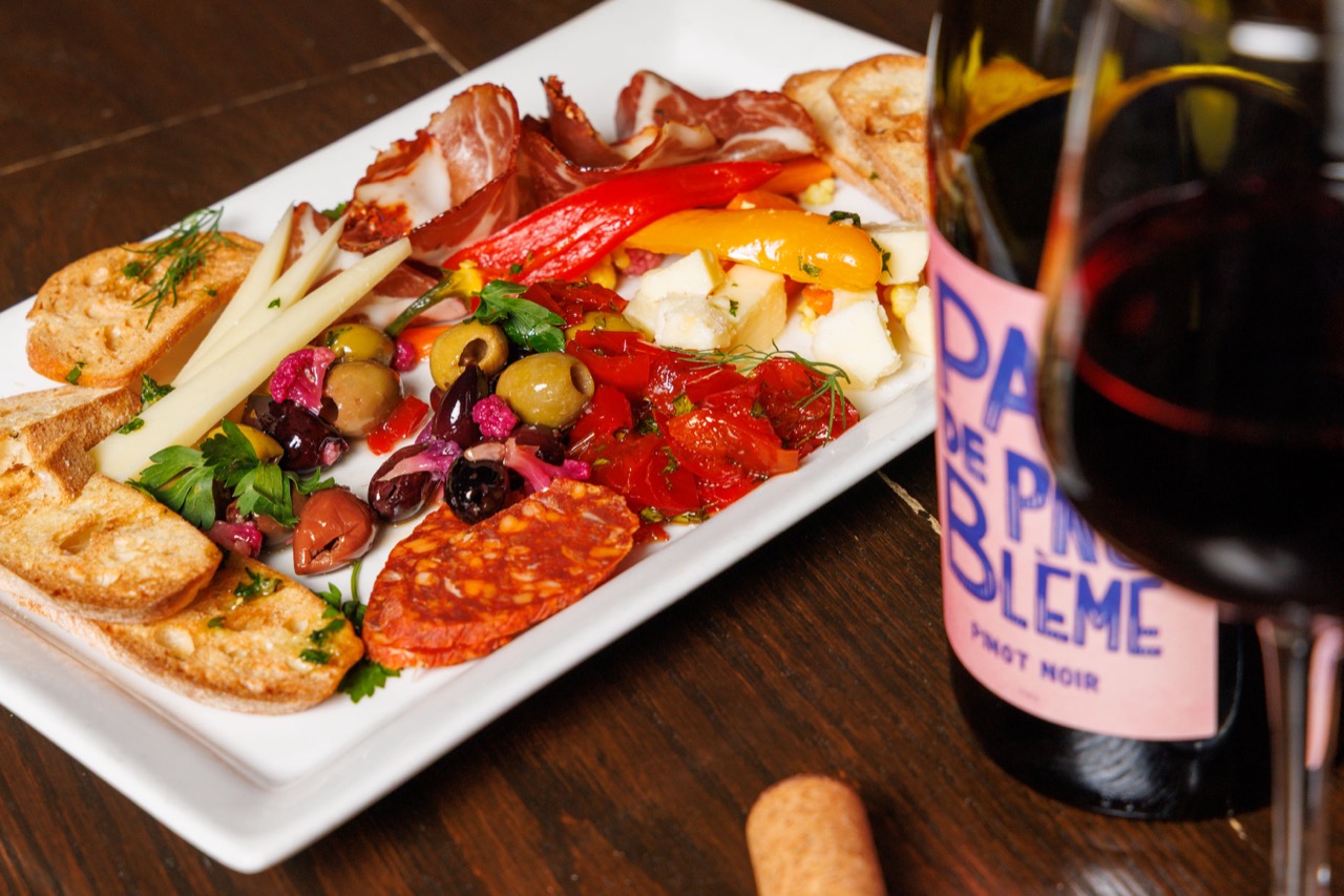 Charcuterie board with artisanal selections for family-style sharing