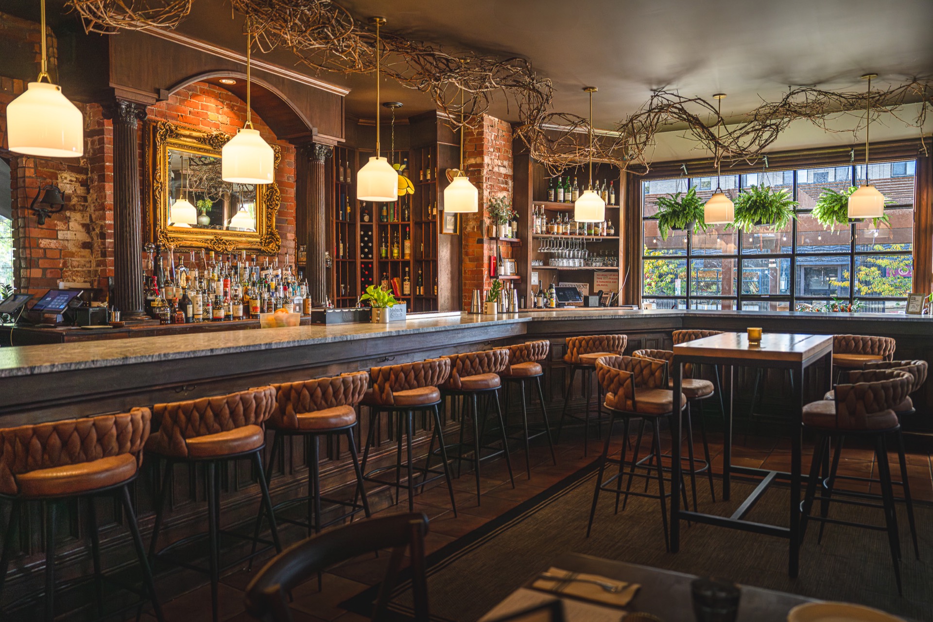 The Alexander bar interior with warm lighting and elegant woodwork