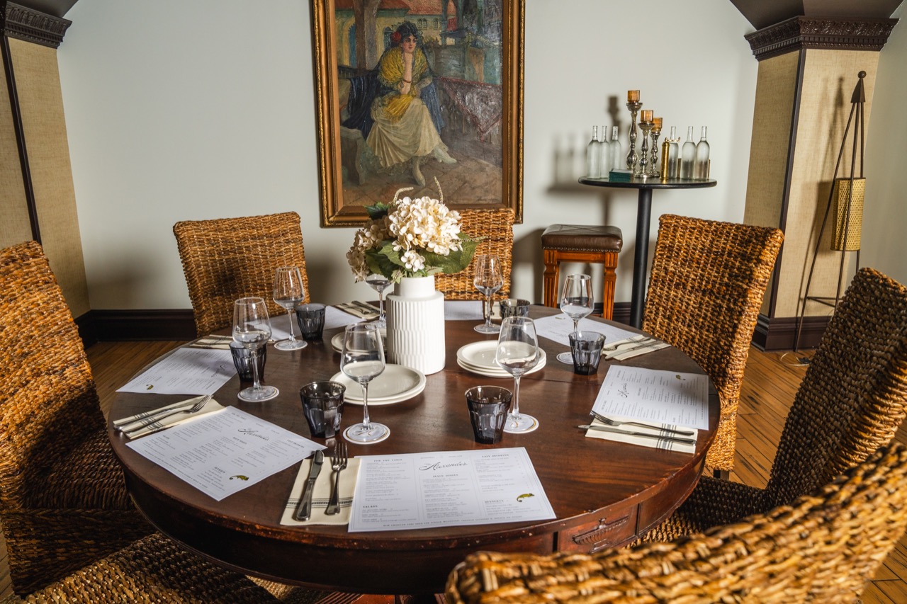 Warm candlelit dinner setting at The Alexander