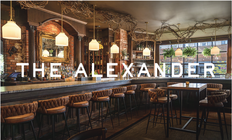 The Alexander sign on the historic Victorian building